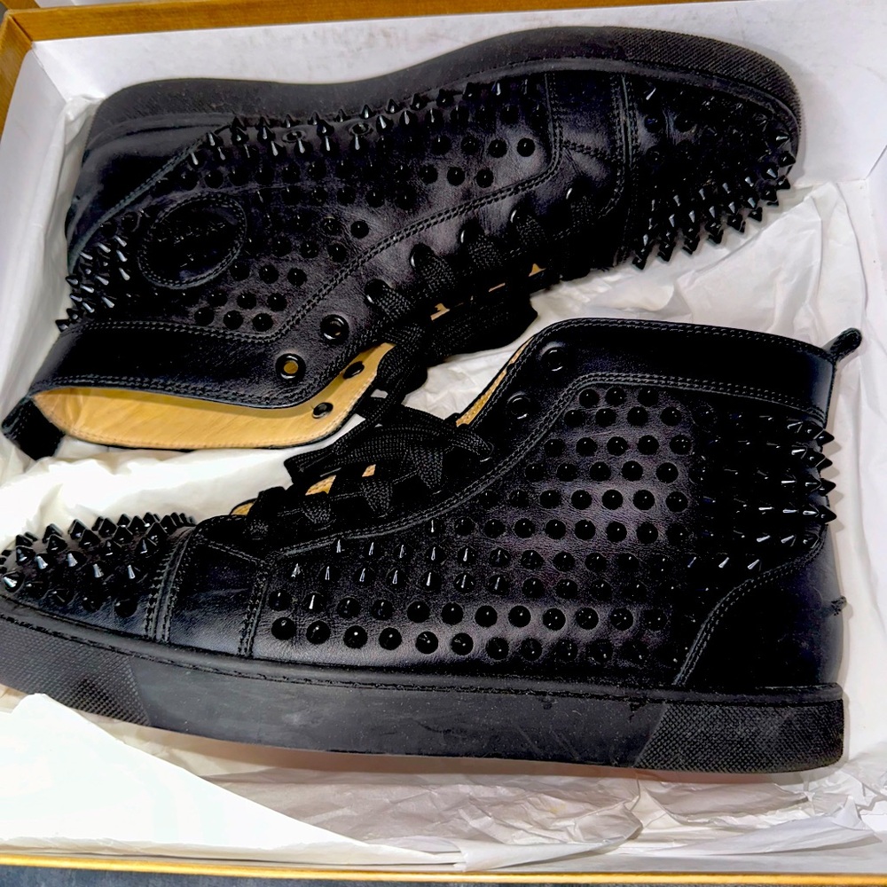 Authentic Christian Louboutin men’s spiked sneakers in excellent condition.